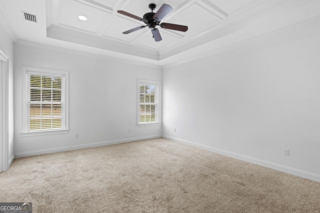 carpeted spare room with baseboards, visible vents, coffered ceiling, ceiling fan, and ornamental molding