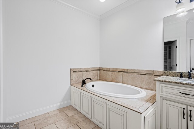 bathroom with baseboards, a garden tub, ornamental molding, tile patterned floors, and vanity