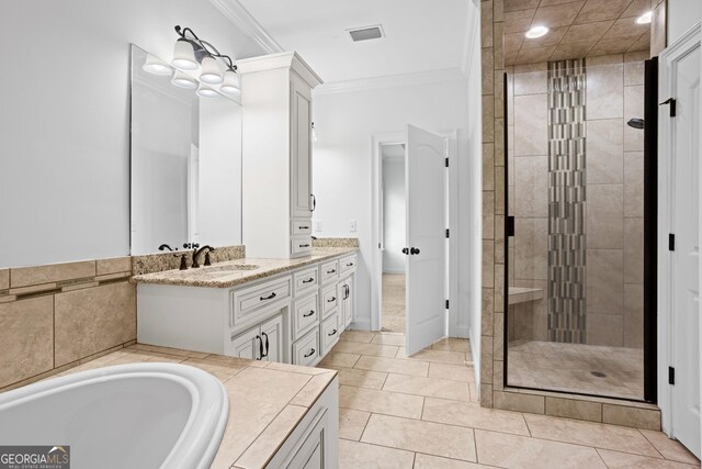 bathroom with vanity, visible vents, a stall shower, tile patterned flooring, and crown molding