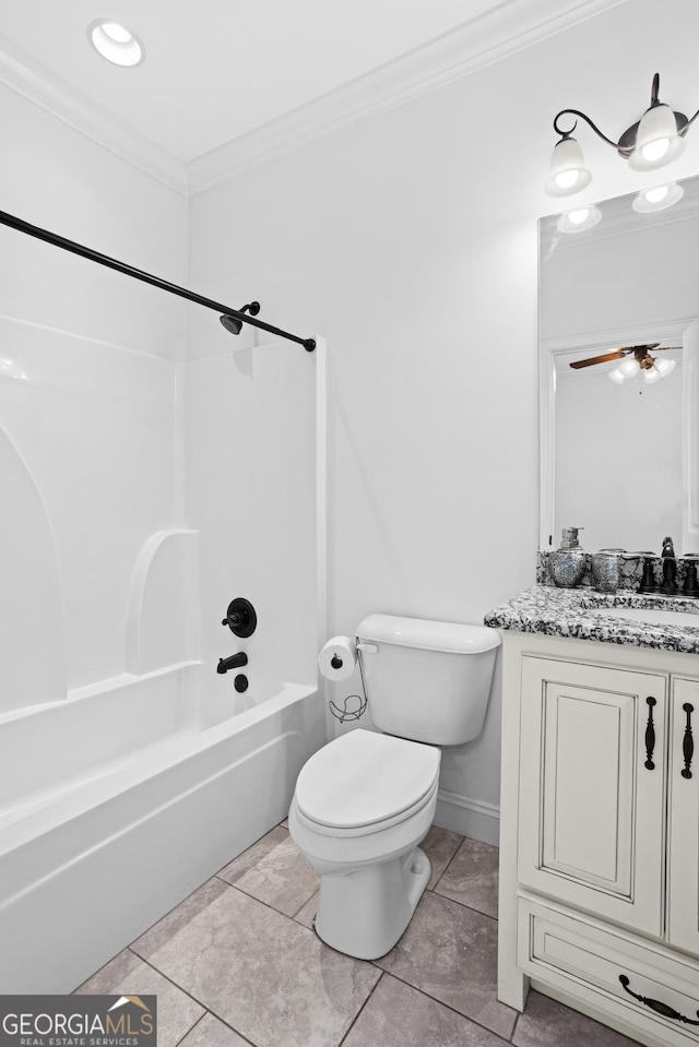 bathroom with vanity, crown molding, toilet, and shower / bath combination