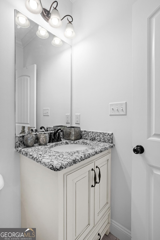 bathroom featuring vanity and baseboards