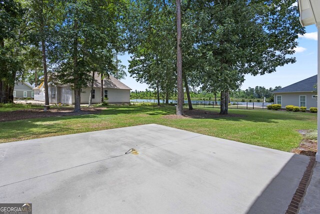 view of patio featuring fence