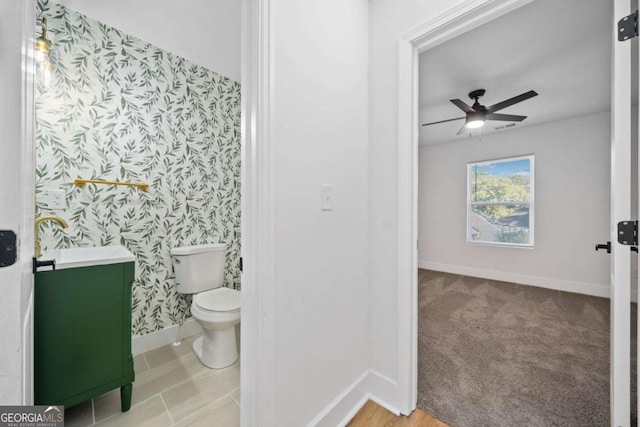 bathroom with vanity, ceiling fan, and toilet