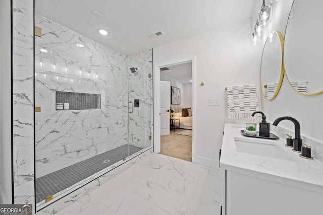 bathroom featuring vanity and a shower with door