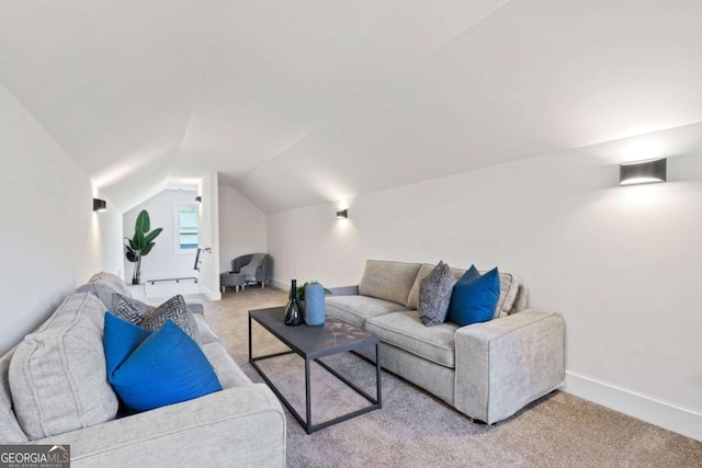 living room featuring vaulted ceiling and light colored carpet