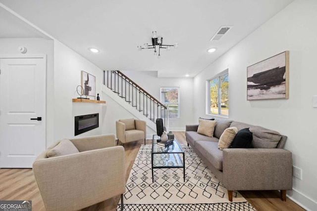 living room with light hardwood / wood-style flooring