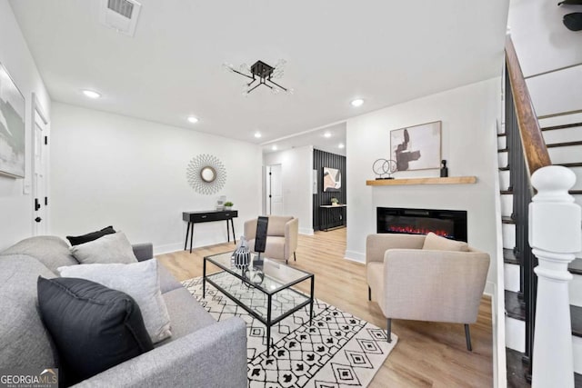 living room with light hardwood / wood-style flooring