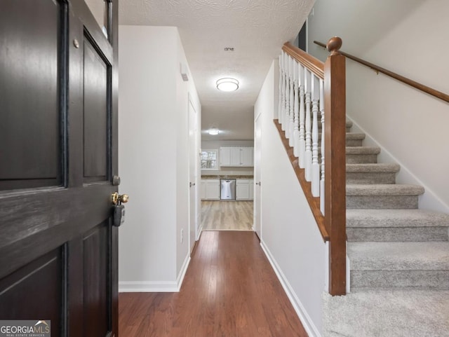 interior space with dark hardwood / wood-style floors and a textured ceiling