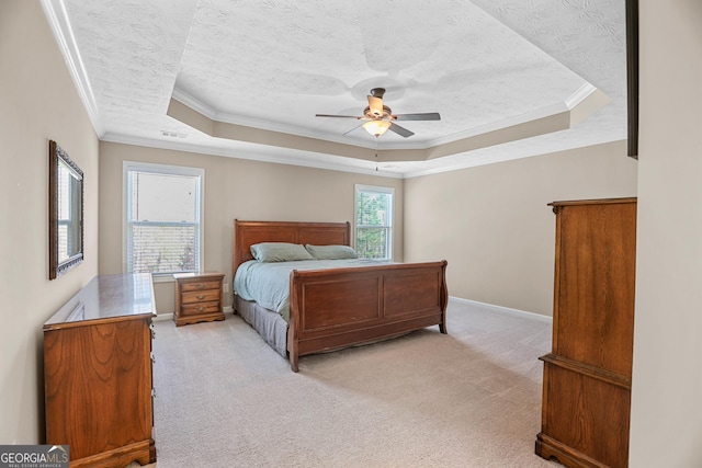 bedroom featuring a textured ceiling, light colored carpet, visible vents, a raised ceiling, and crown molding