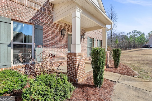 view of exterior entry featuring a porch