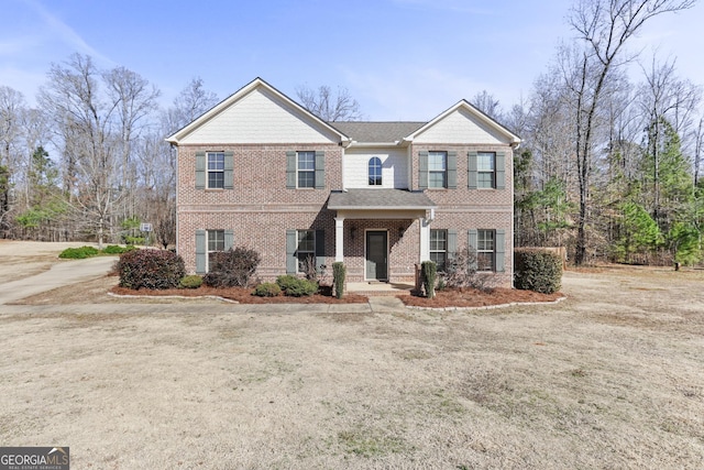 view of front of house with brick siding