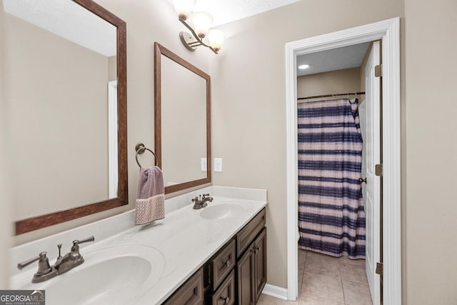 bathroom with vanity, a shower with curtain, and tile patterned floors