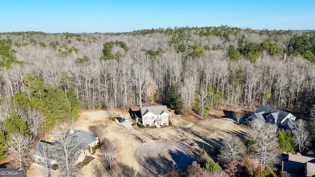 bird's eye view featuring a view of trees