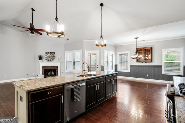 kitchen with dark wood-style flooring, a fireplace, a sink, open floor plan, and dishwasher