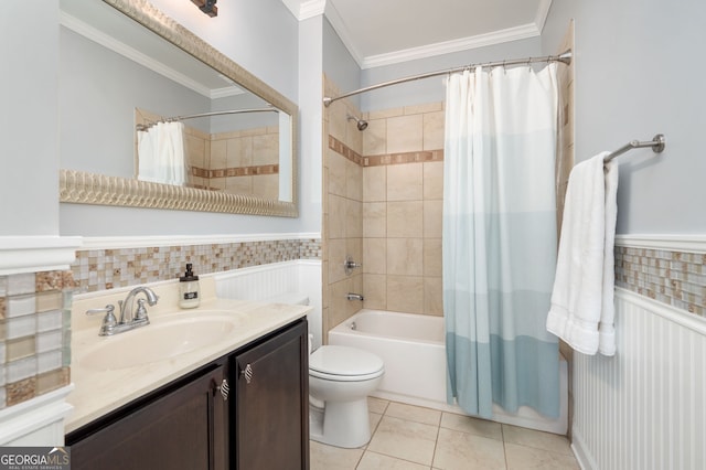 bathroom featuring ornamental molding, a wainscoted wall, shower / bathtub combination with curtain, and tile patterned floors