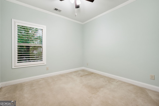 unfurnished room with ornamental molding, visible vents, light carpet, and baseboards