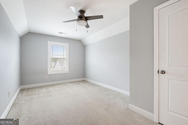 additional living space with lofted ceiling, ceiling fan, carpet flooring, visible vents, and baseboards