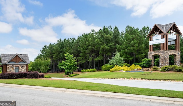 view of property's community with a yard