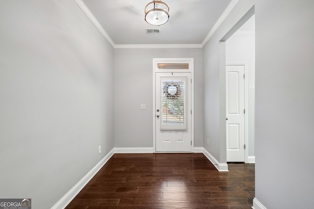 foyer featuring baseboards, visible vents, wood finished floors, and ornamental molding