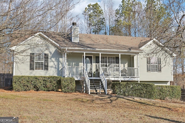 view of front of house featuring a front lawn and a porch