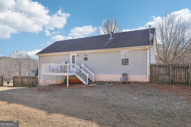 view of front of property with a wooden deck