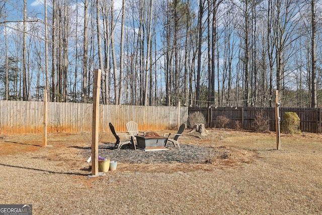 view of yard featuring a fire pit