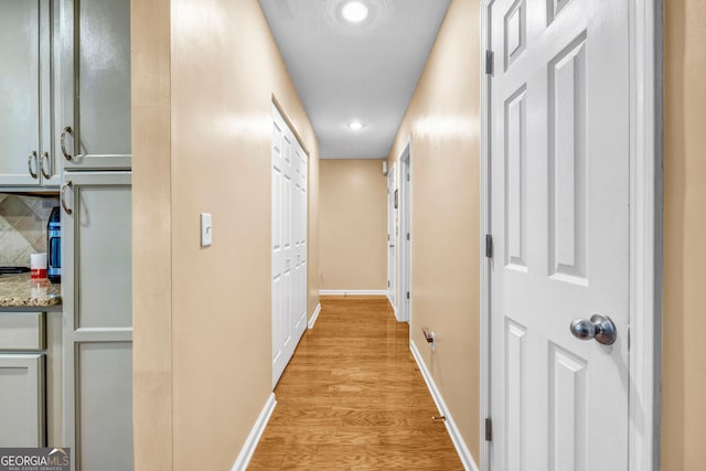 hall with light wood-type flooring