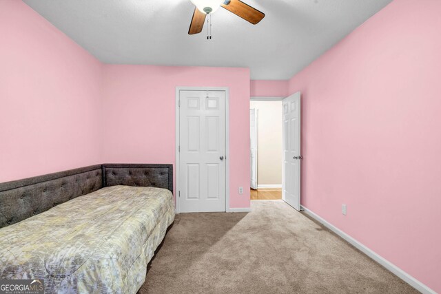 full bathroom featuring hardwood / wood-style flooring, shower / tub combo with curtain, vanity, and toilet