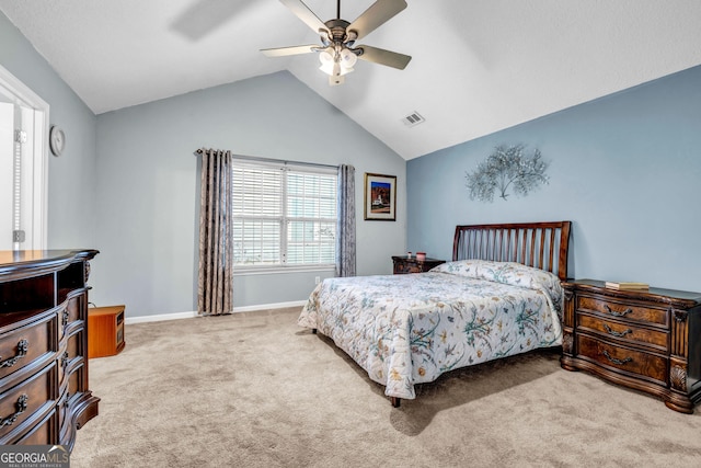 carpeted bedroom with vaulted ceiling and ceiling fan