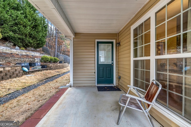 entrance to property with a patio