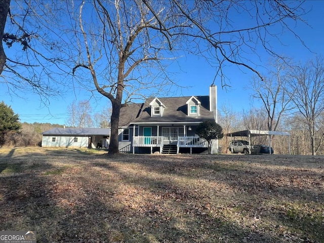 view of front of home with a carport and covered porch