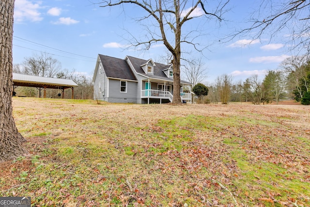 exterior space with a yard and covered porch