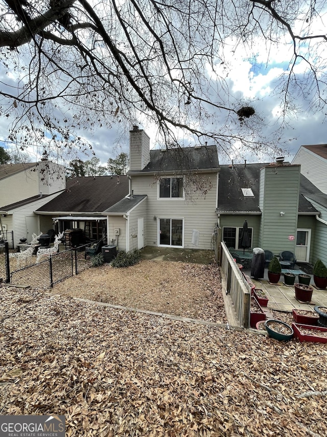 rear view of house with a patio