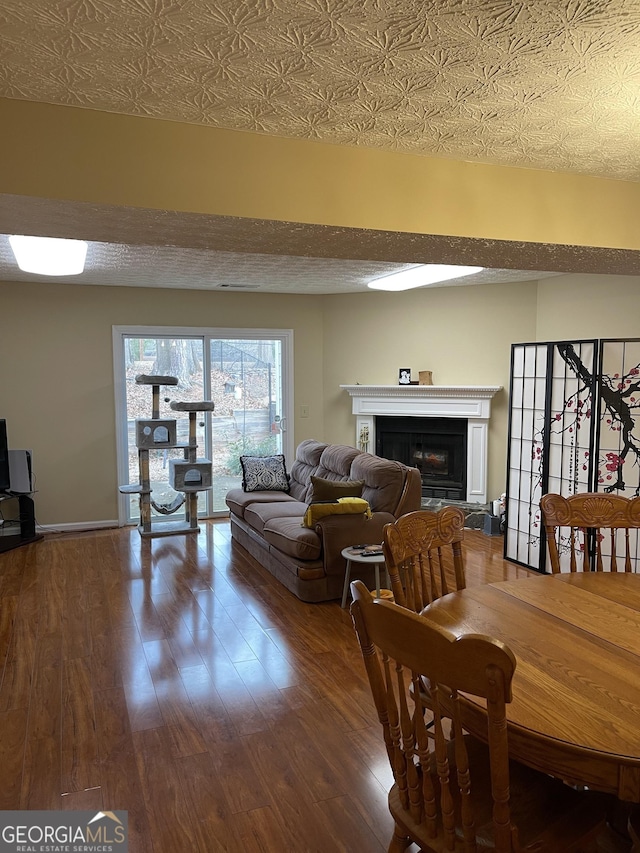 dining space featuring wood-type flooring