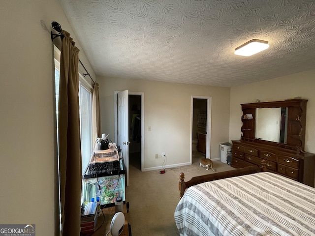 bedroom featuring carpet floors and a textured ceiling