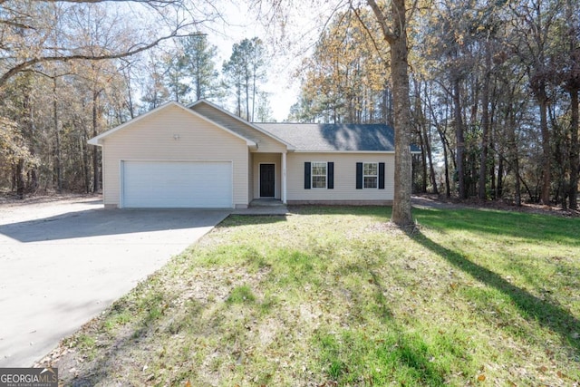 ranch-style home featuring a garage and a front yard