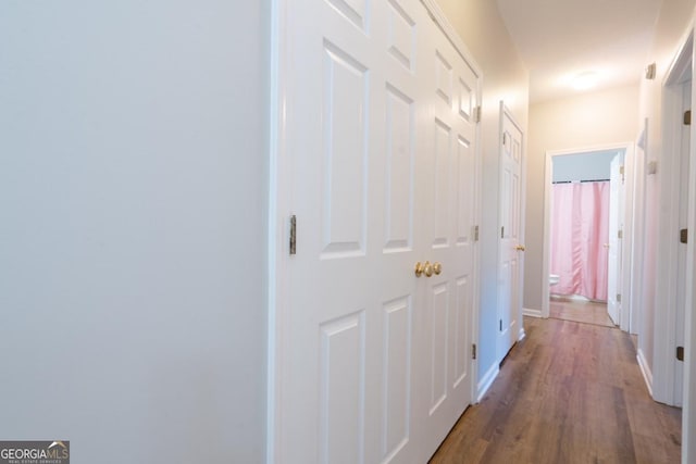 hallway featuring hardwood / wood-style floors