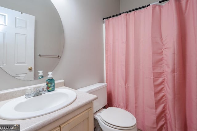 bathroom with vanity and toilet