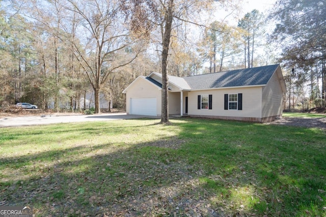 ranch-style house featuring a garage and a front yard