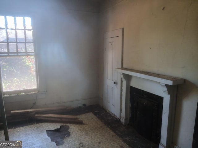 unfurnished living room with a fireplace