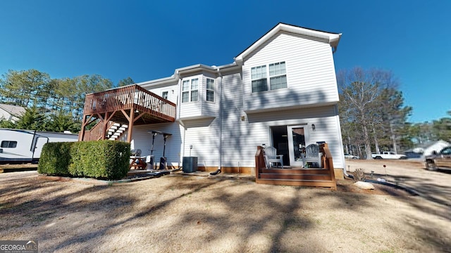 back of property with a wooden deck