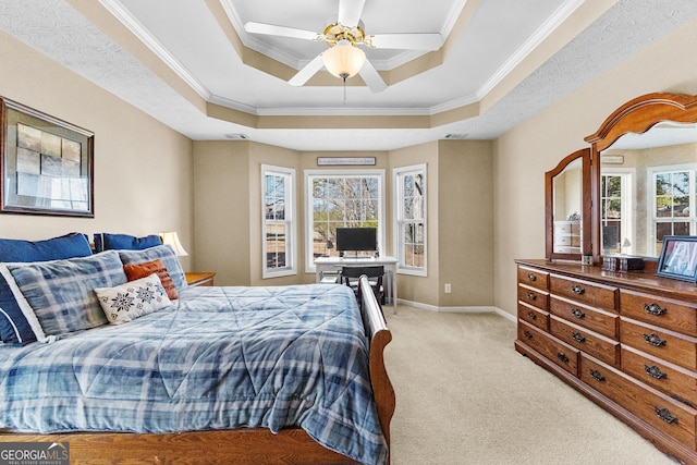 bedroom featuring a raised ceiling, crown molding, light colored carpet, and ceiling fan