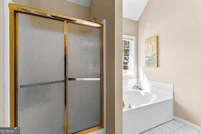 bathroom featuring independent shower and bath and tile patterned flooring