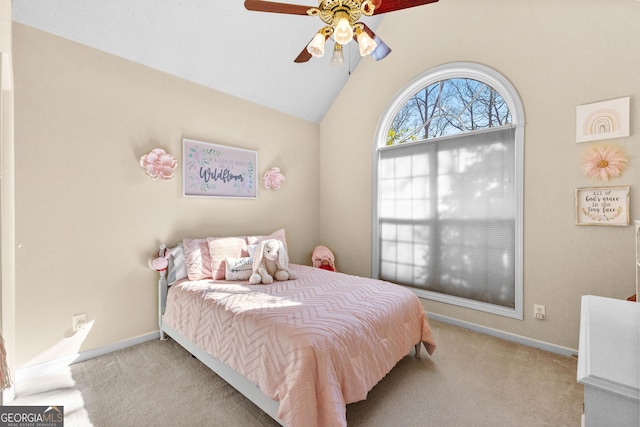 bedroom featuring ceiling fan, lofted ceiling, and light carpet