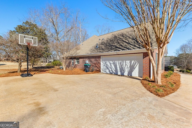 view of side of home featuring a garage