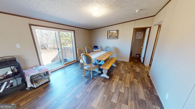 231 Canady Bridge Rd, Twin City, GA 30471 - dining space with lofted ceiling, wood finished floors, a textured ceiling, and ornamental molding
