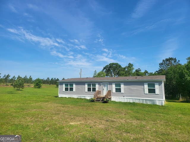 231 Canady Bridge Rd, Twin City, GA 30471 - manufactured / mobile home featuring a front lawn