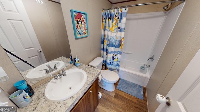 231 Canady Bridge Rd, Twin City, GA 30471 - full bath featuring wood finished floors, vanity, shower / bathtub combination with curtain, and toilet