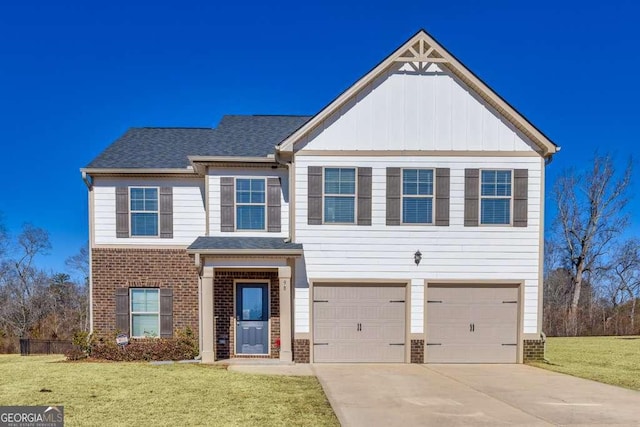 view of front facade with a garage and a front lawn