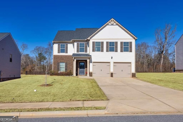 view of front property featuring a garage and a front yard